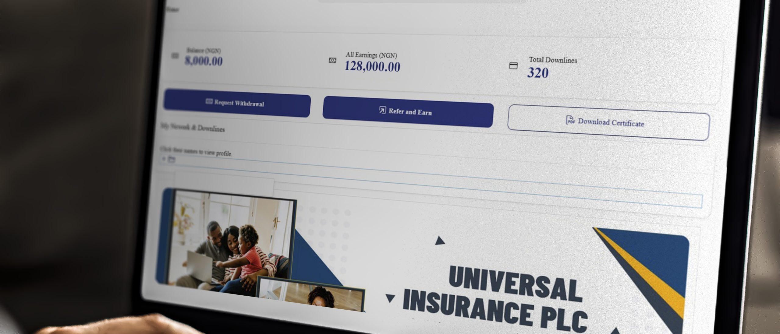 Working on a web template on the laptop - Universal Insurance Network (UIN)