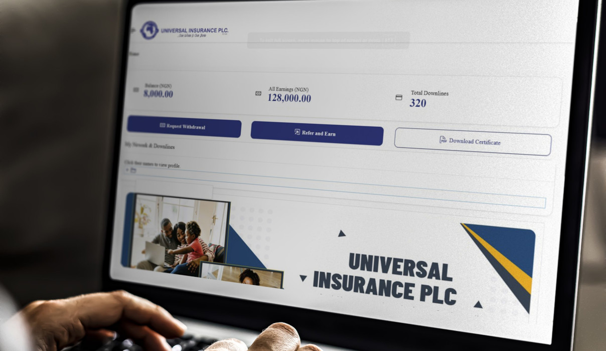 Working on a web template on the laptop - Universal Insurance Network (UIN)