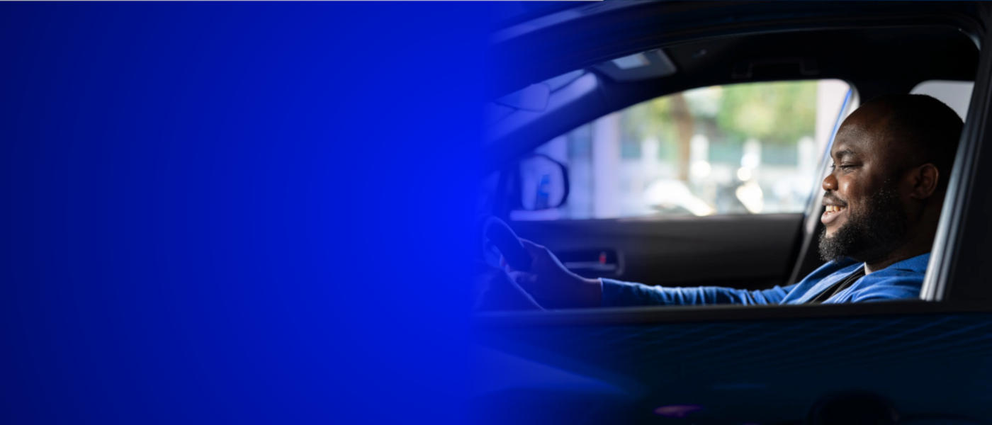 A man happily driving his car